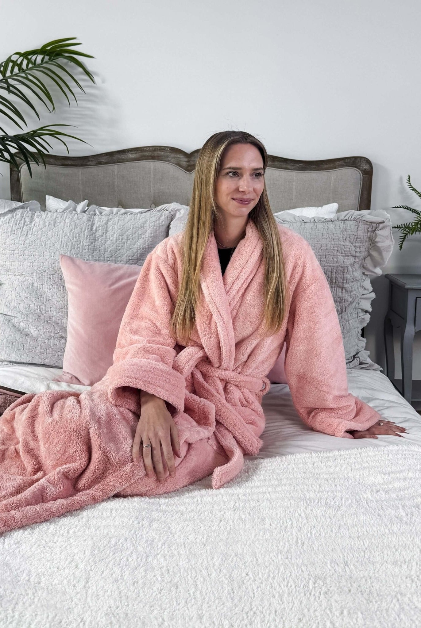 WARM BUDDY - Cozy Ultra Plush Spa Robe in Pink, Shown on a women on a bedroom setting