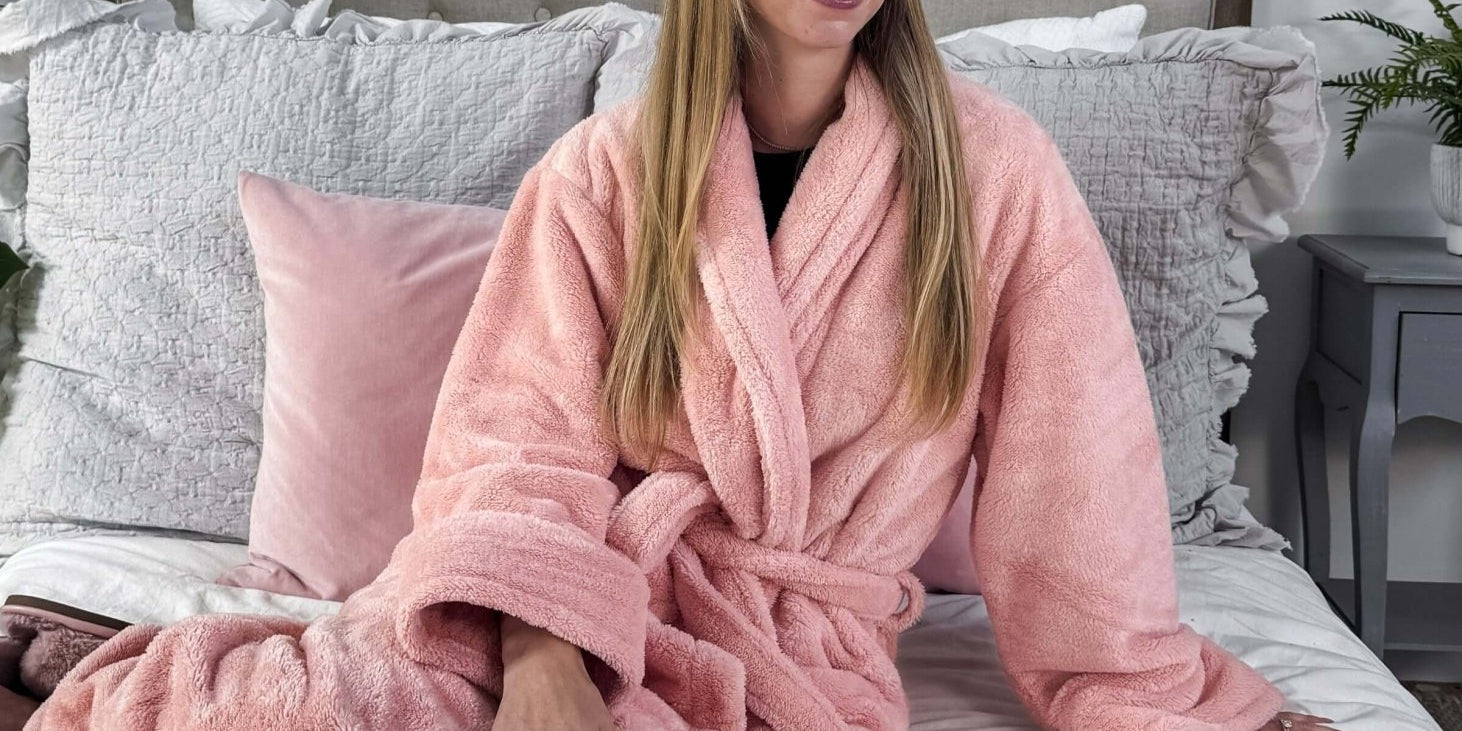 WARM BUDDY - Cozy Ultra Plush Spa Robe in Pink, Shown on a women on a bedroom setting