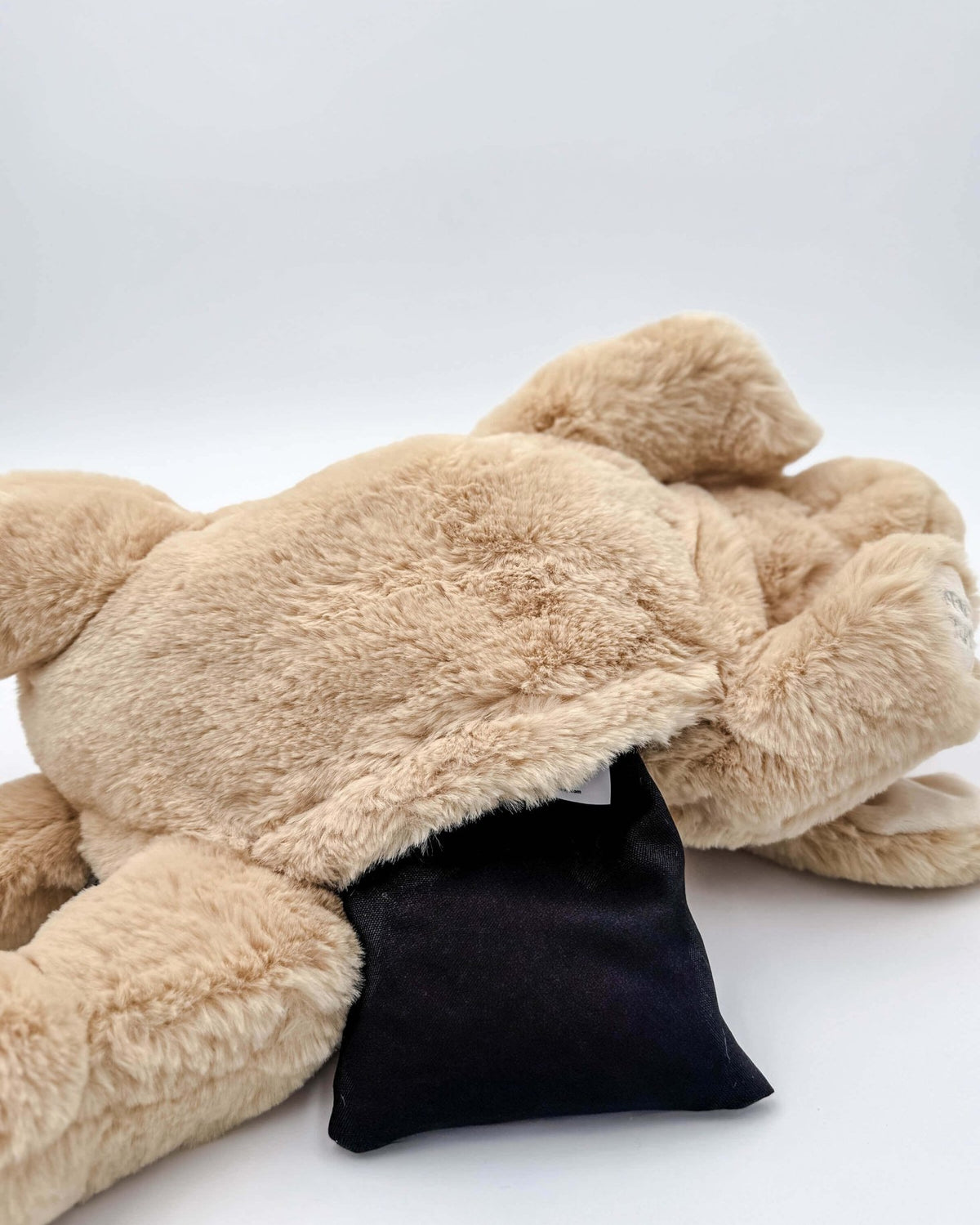 Warm Buddy Cuddle Buddy Tan Lab Puppy 18" Heat Up Stuffed Animal therapeutic heat up beige dog weighted showing the opening for the microwaveable heat pack