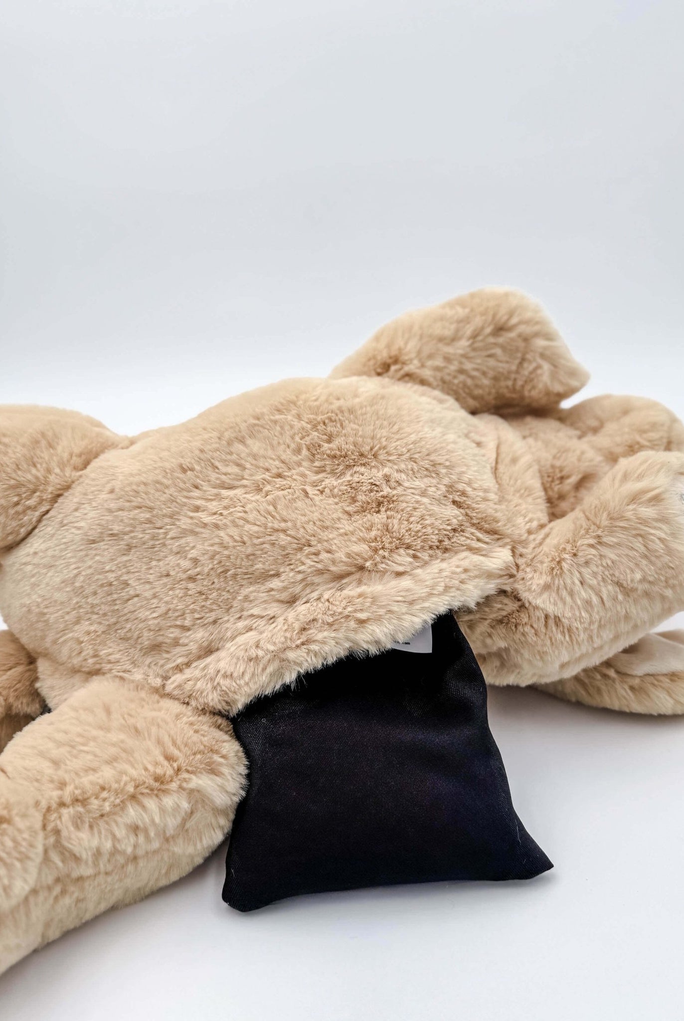 Warm Buddy Cuddle Buddy Tan Lab Puppy 18" Heat Up Stuffed Animal therapeutic heat up beige dog weighted showing the opening for the microwaveable heat pack