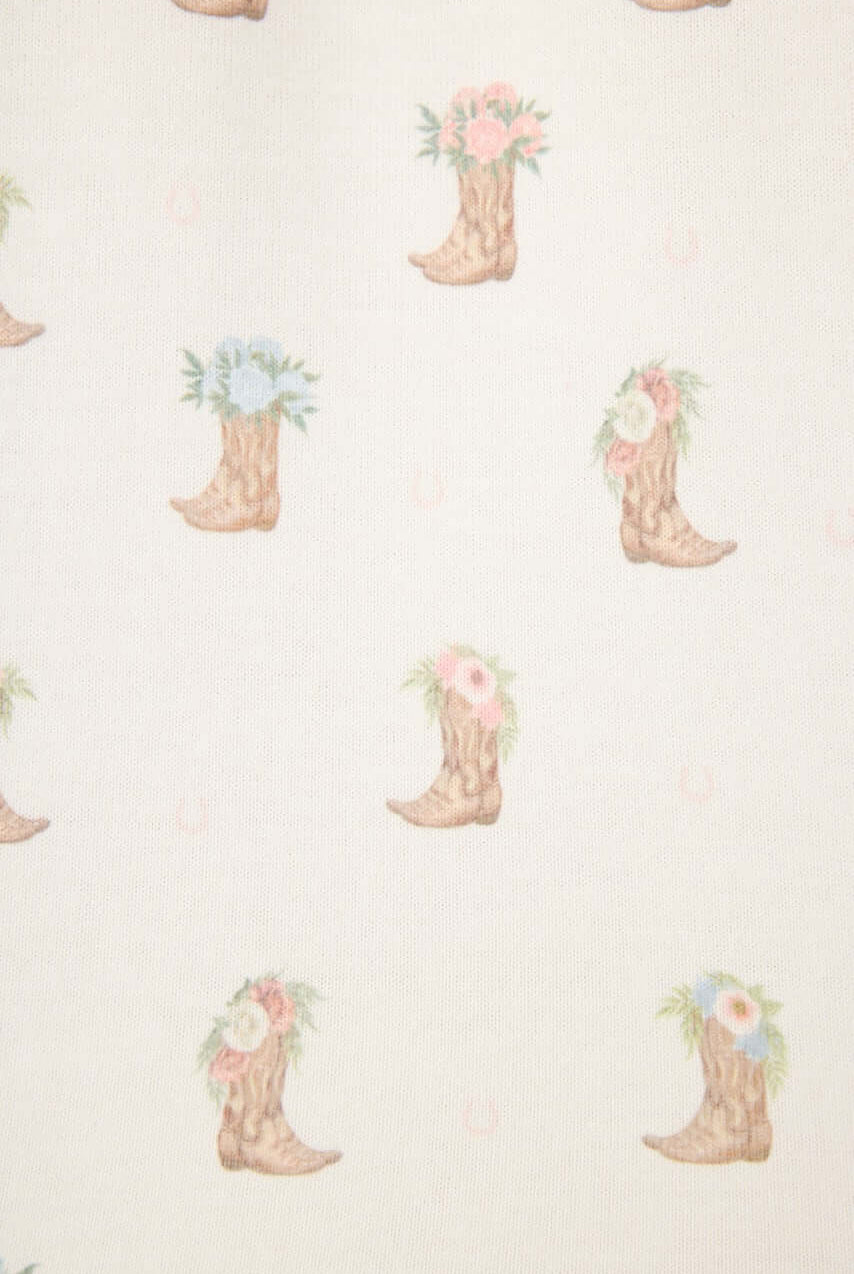 Western Blooms Boot Bouquet pattern featuring floral cowboy boots on an ivory background.