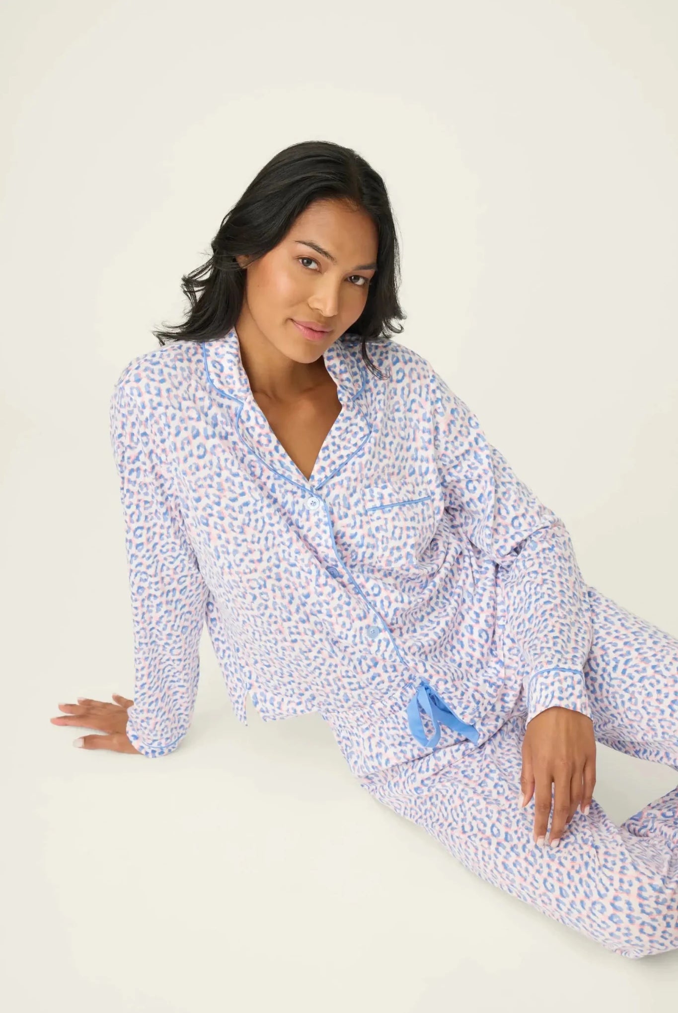 Model wearing Whimsy Walk On The Wild Side PJ Set by PJ Salvage, featuring colorful leopard print and comfortable design.