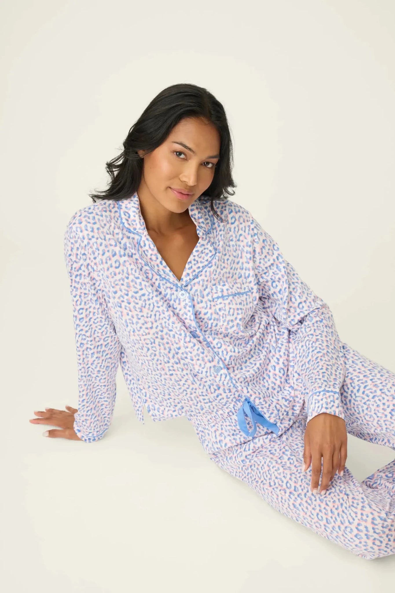 Model wearing Whimsy Walk On The Wild Side PJ Set by PJ Salvage, featuring colorful leopard print and comfortable design.