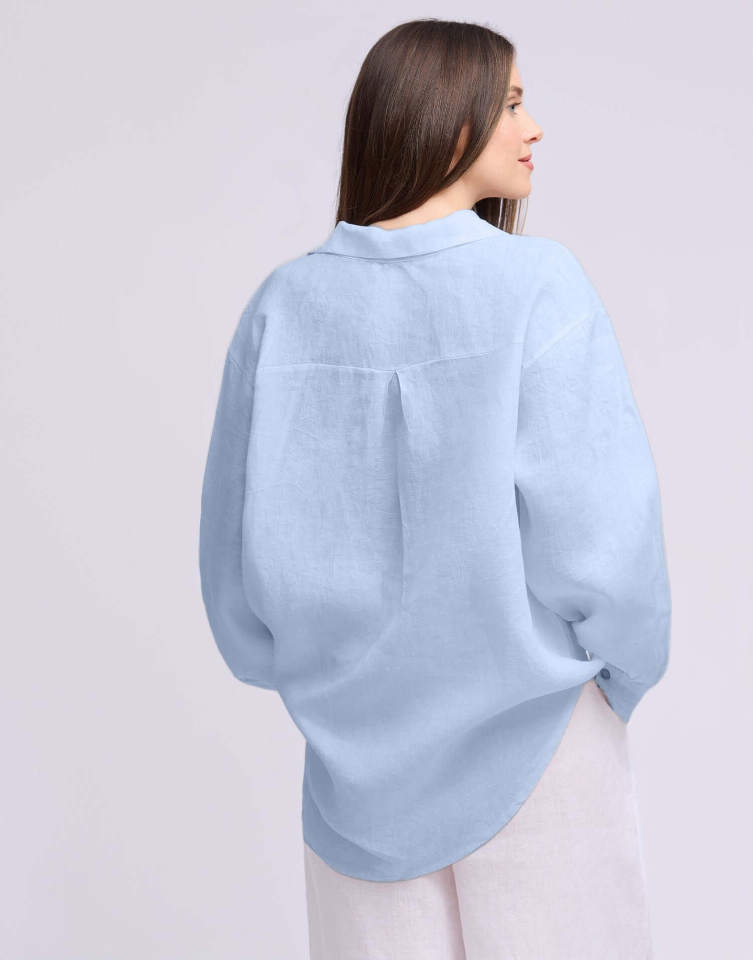 Yoga Jeans Elena Linen Oversized Button Up Top in light blue, showcasing a chic, relaxed fit from the back.