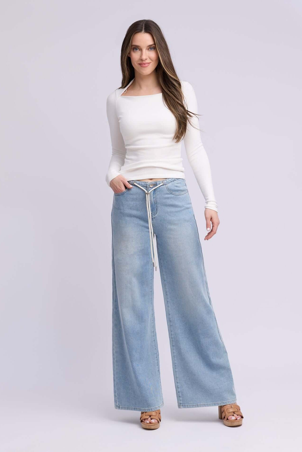Yoga Jeans LILY Wide Leg Drawstring Jeans in Rihanna Wash, styled with a fitted long-sleeve top.