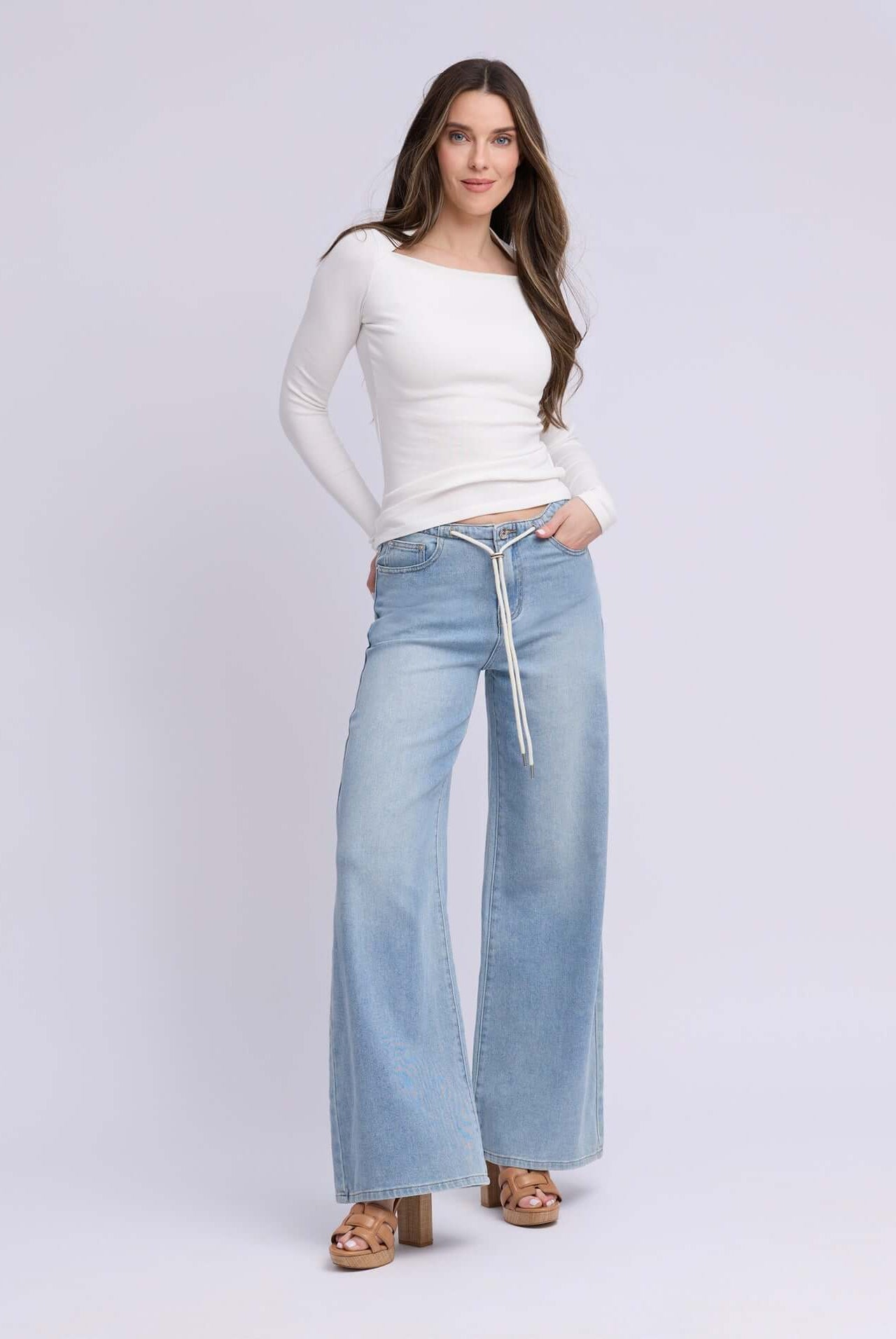 Yoga Jeans LILY Wide Leg Drawstring Jeans - Rihanna Wash model wearing a white top and wide leg jeans.