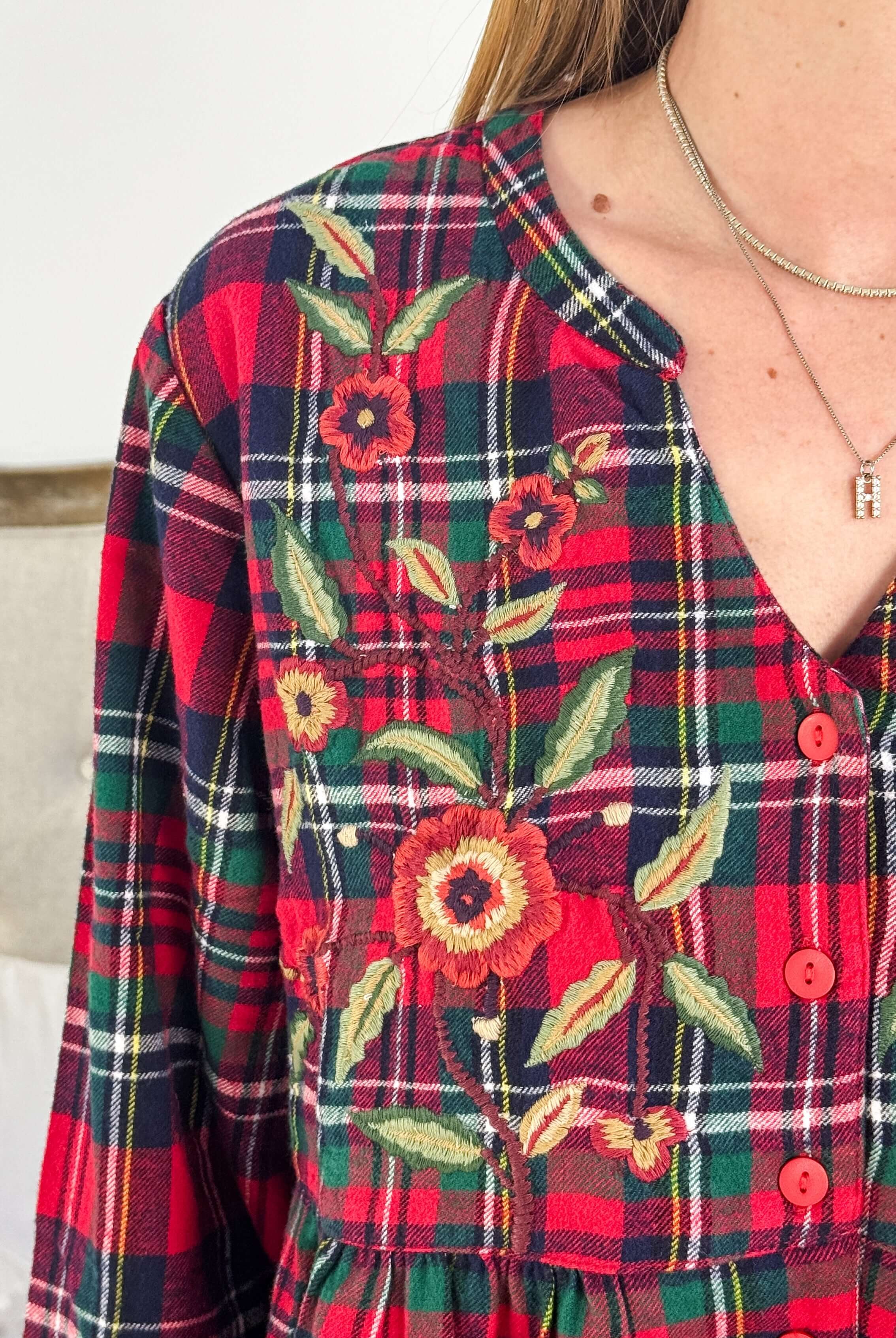 Close-up of Yuletide Check Long Flannel Nighty featuring floral embroidery in red plaid pattern by April Cornell.