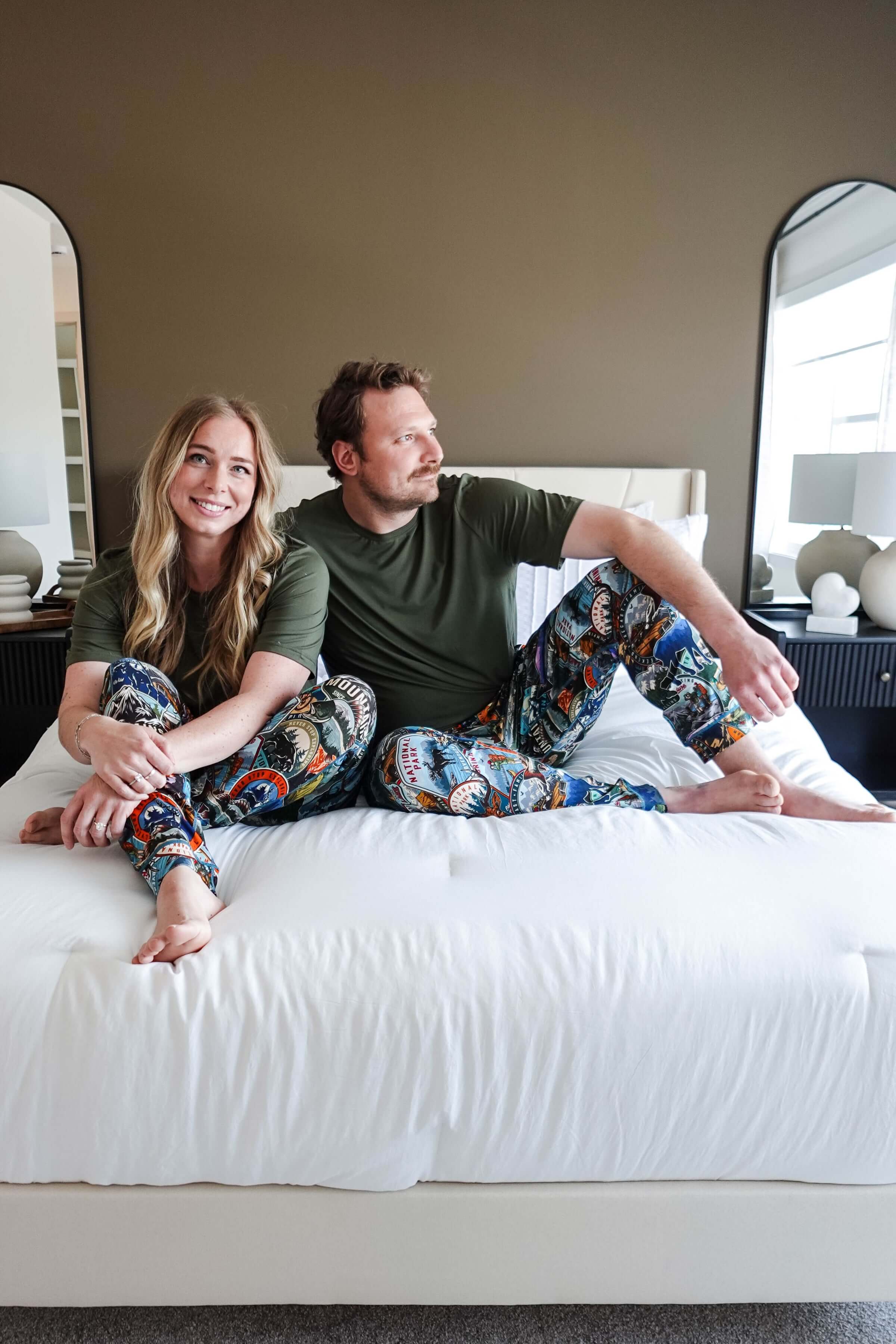 Bob's Sleepwear Co. Unisex Bamboo Loungewear worn by a man and woman lounging on a bed.