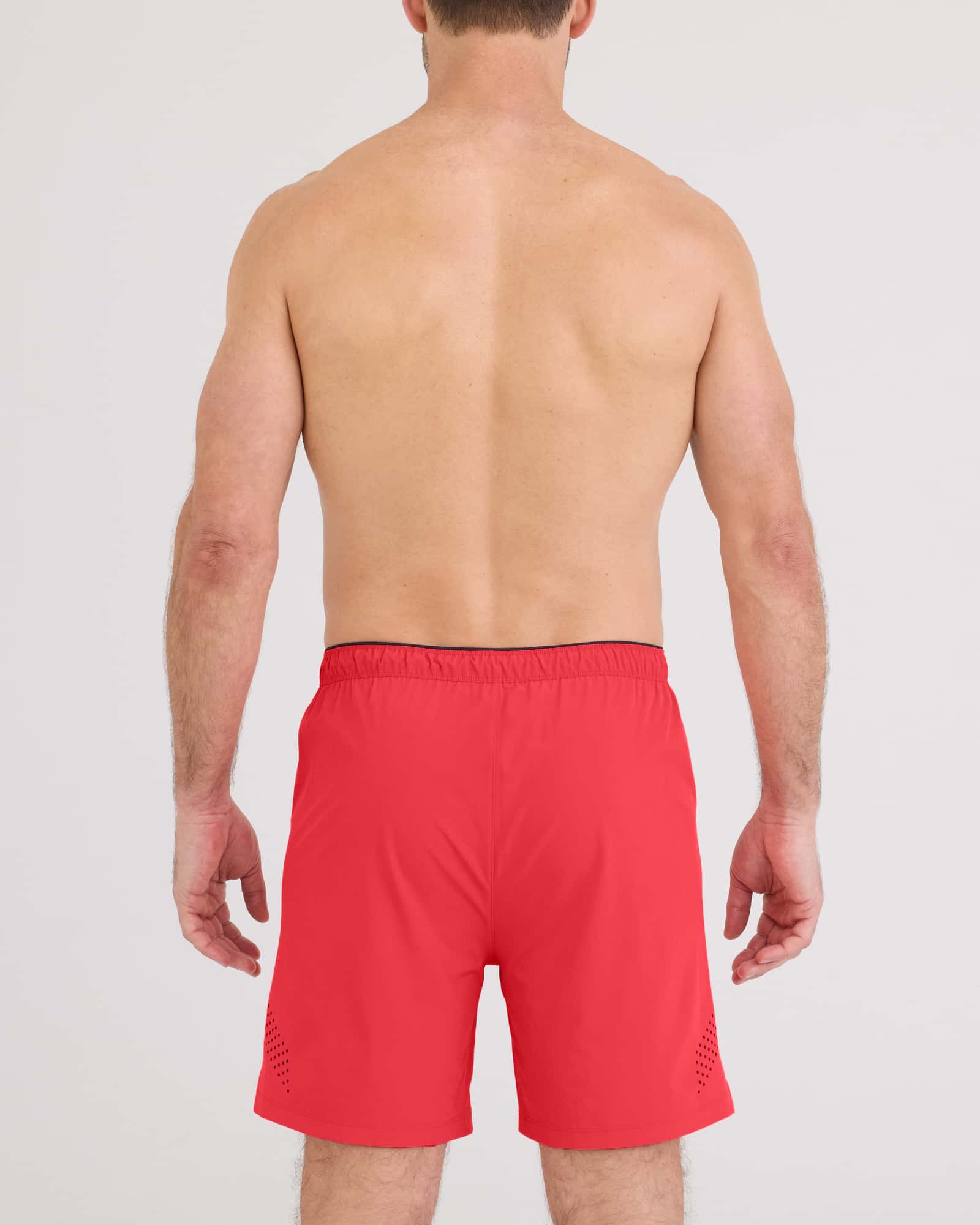 Back view of a man wearing Power Moves 2N1 Short 7 in red, showcasing the fit and design for athletic performance.
