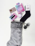 Spa In A Stocking Gift Set with luxurious pampering products and cozy socks for a mini self-care retreat.