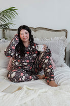 plus size woman wearing book club print velour lounge set with jogger 