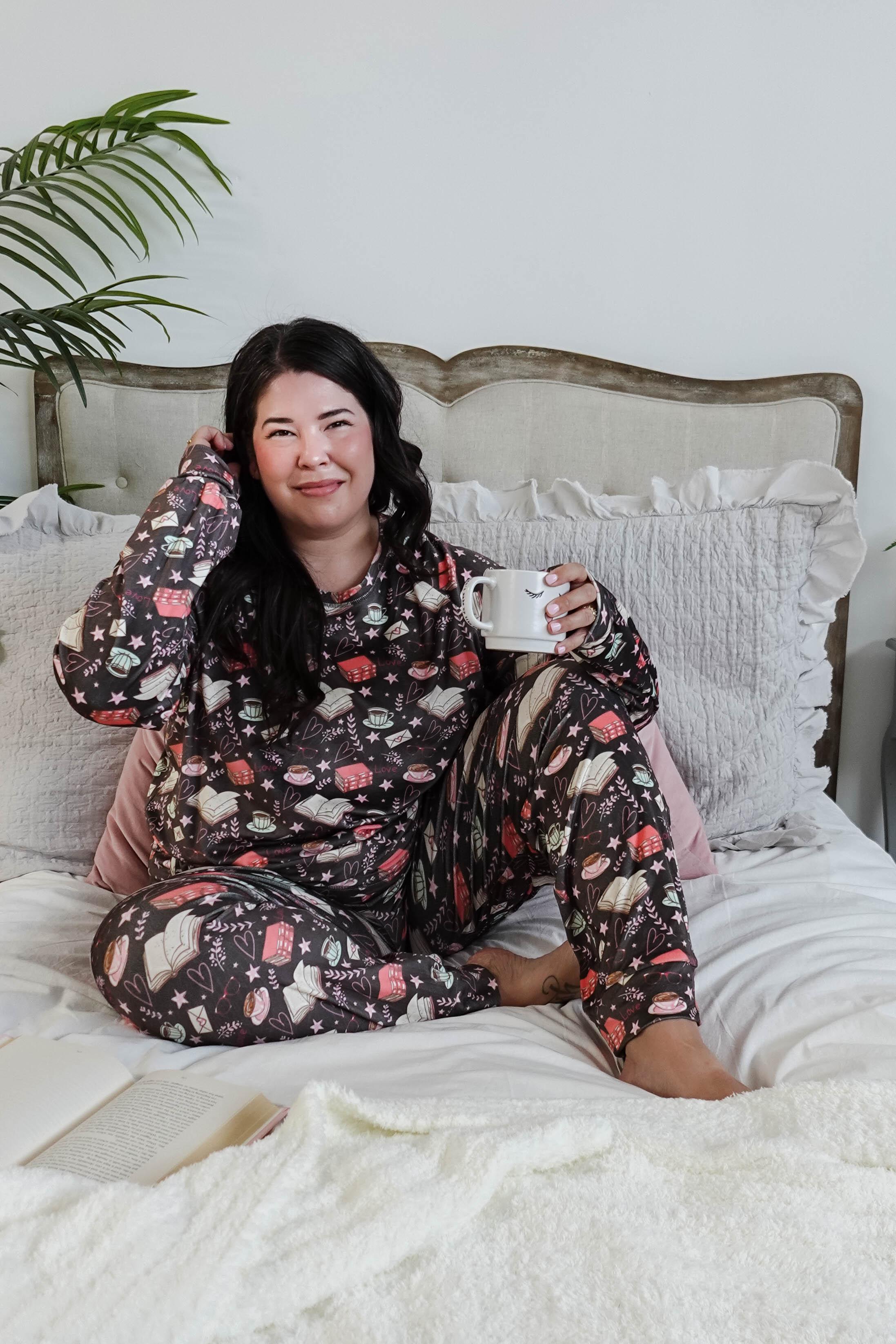 plus size woman wearing book club print velour lounge set with jogger 