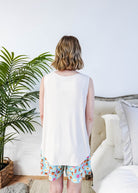 Back view of Miranda wearing the Brunch Club velour shorts with eggs and bacon print and ivory peachy tank.