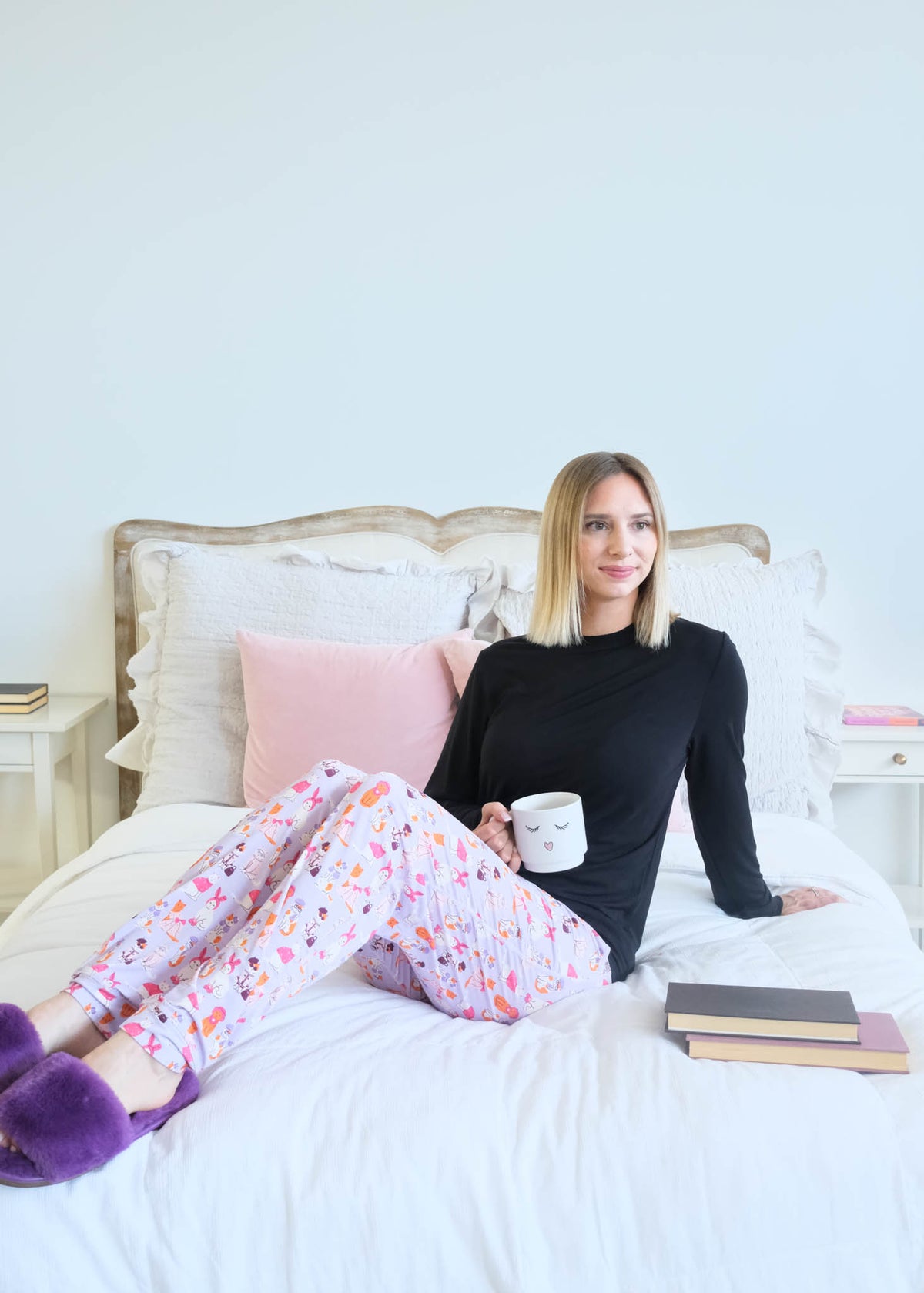 Georgia Rylan Black Long Sleeve Catwalk Print Jogger Bamboo PJ Set lifestyle photo on bed — Cloud Nine Pajamas Edmonton