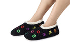 Snoozies Mini Embroidery Slipper Socks Mini Paws Black lifestyle on feet from side— Cloud Nine Pajamas Edmonton