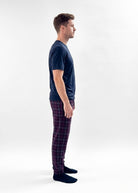 Bob's Sleepwear Co. Dark Red Plaid Bamboo Jogger Pant side view on model — Cloud Nine Pajamas Edmonton