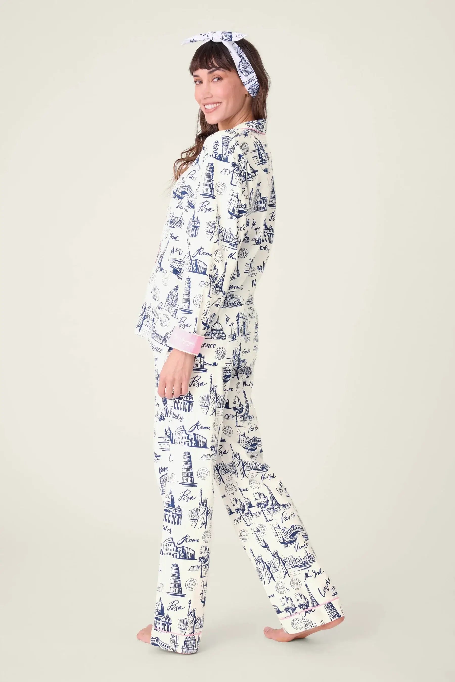 Model wearing BON VOYAGE 3-Piece Flannel PJ Set from PJ SALVAGE with a cheerful smile.