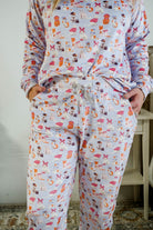 Showing the drawstring detail and pockets on the Miranda Nic women's purple velour long sleeve top and jogger pants set featuring Catwalk Kitties cat print - Cloud Nine Pajamas