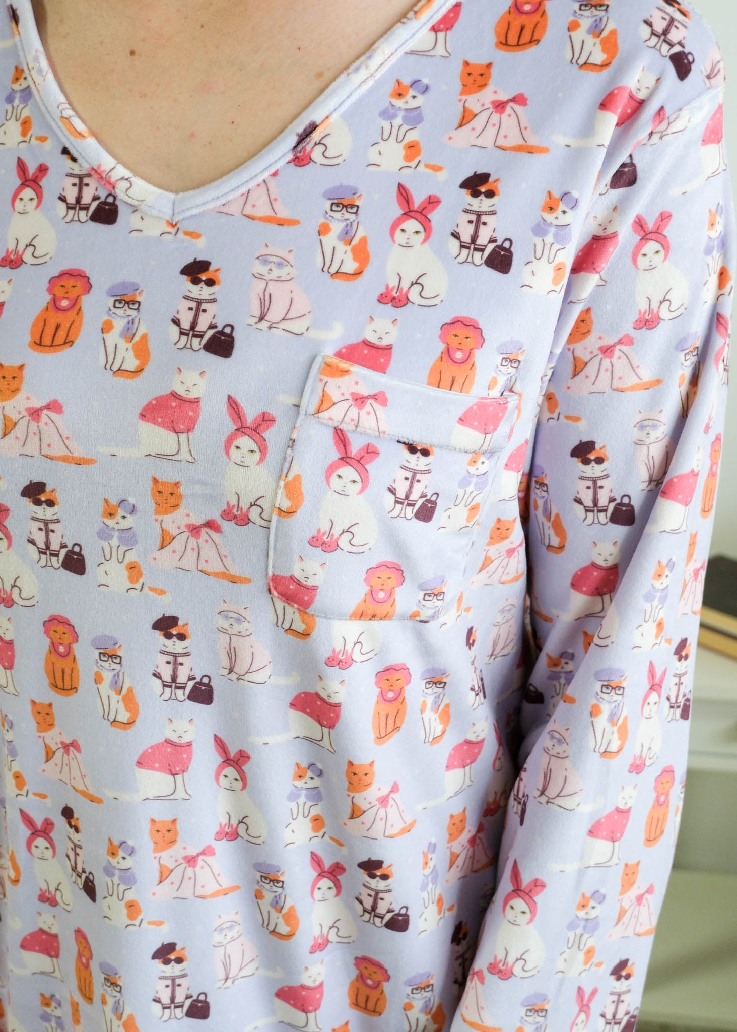 Close up of the Miranda Nic women's purple velour long sleeve nightshirt sleep dress featuring Catwalk Kitties print - Cloud Nine Pajamas.