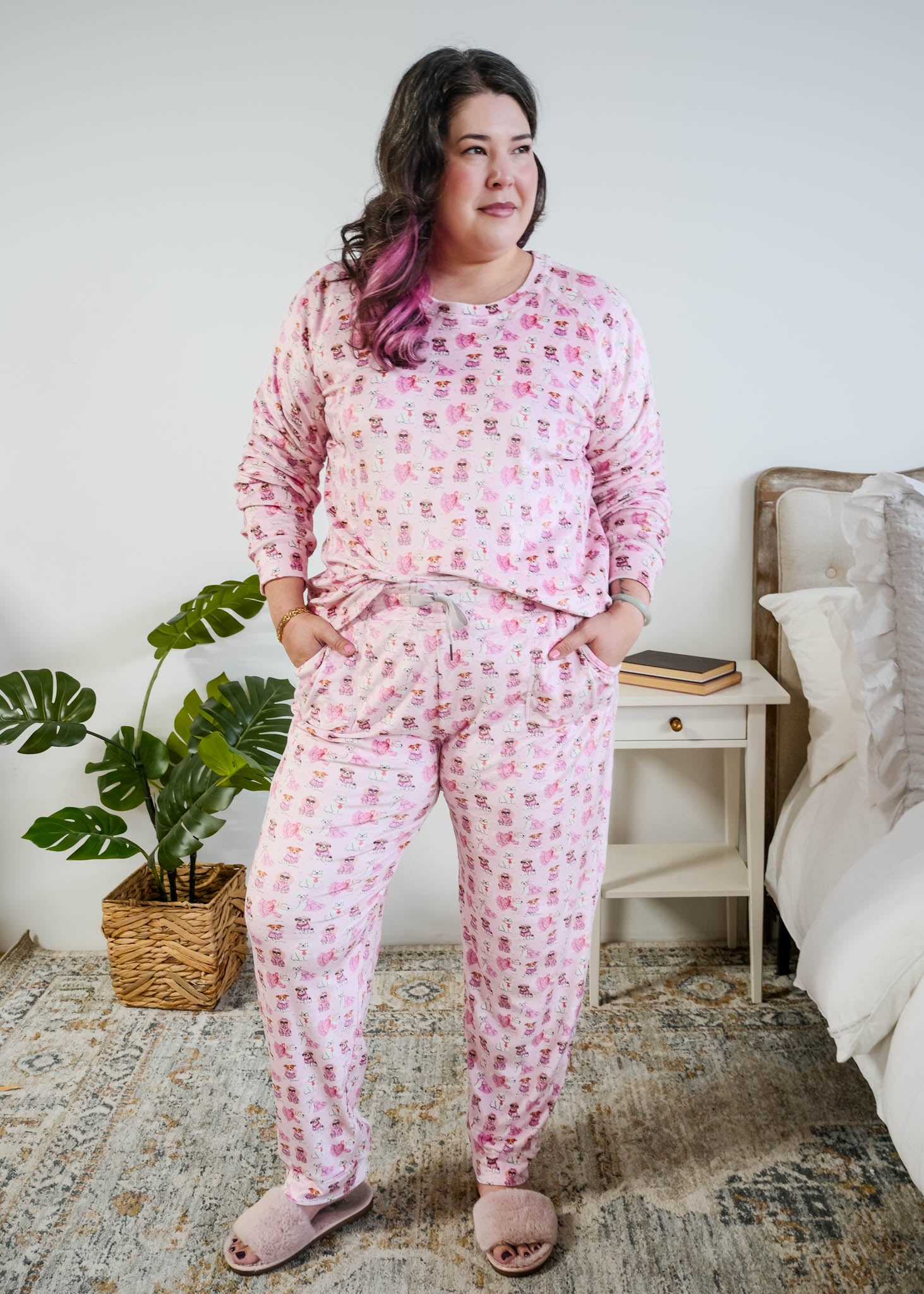 tucked in view on plus size model of the Miranda Nic women's pink velour long sleeve top and jogger pants loungewear set featuring Chic Puppies dog print