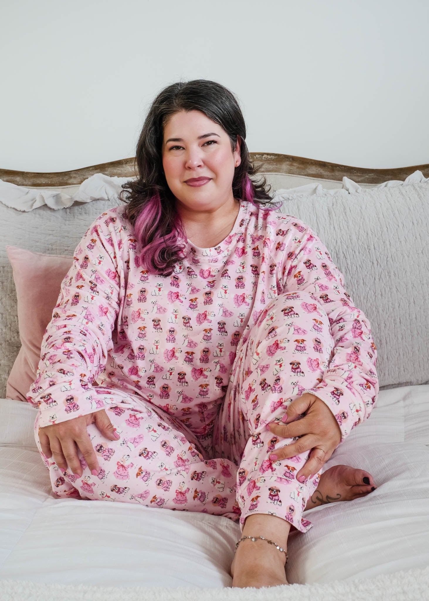 Plus size lifestyle shot on model Miranda Nic women's pink velour long sleeve top and jogger pants loungewear set featuring Chic Puppies dog print