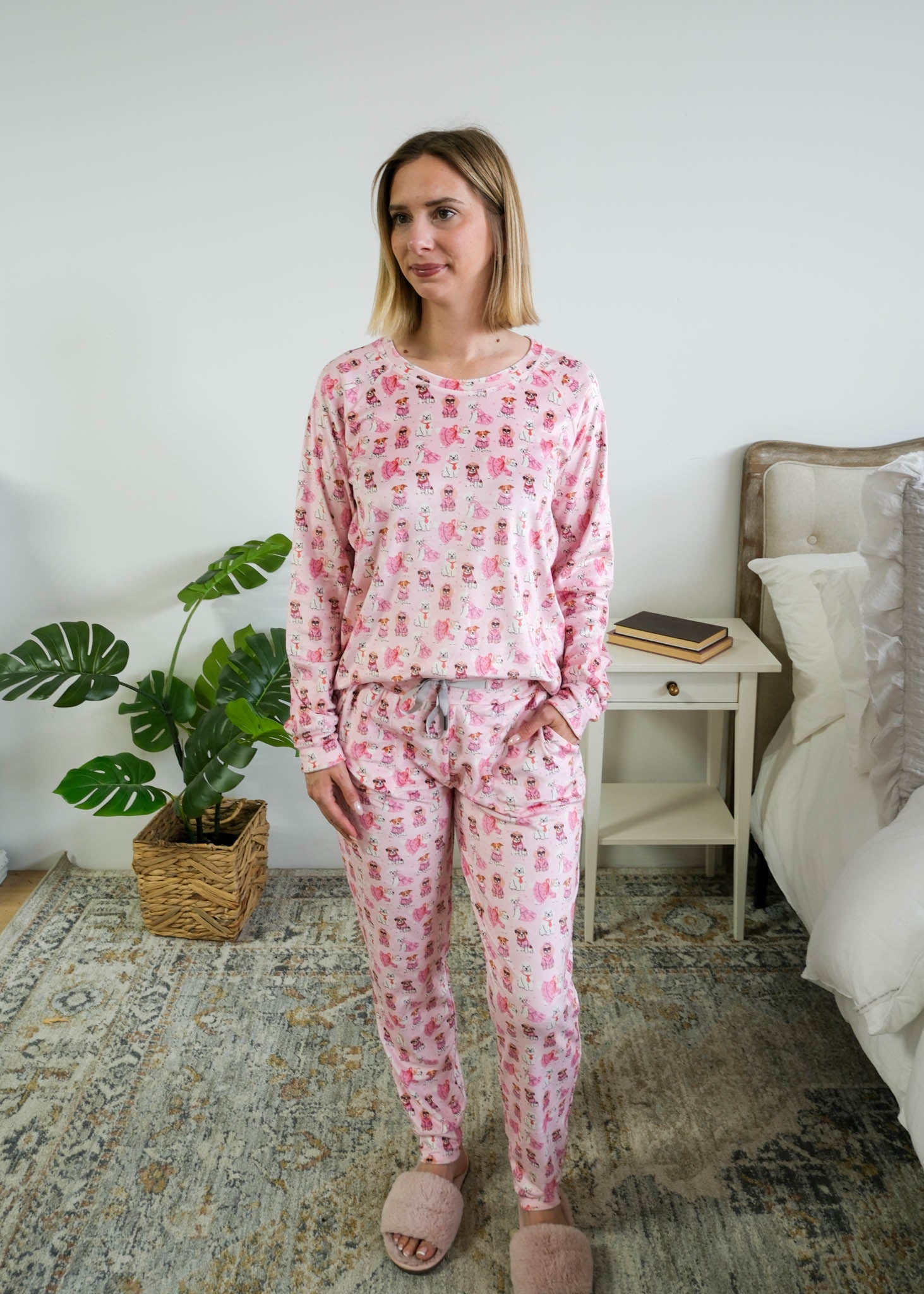 Full length on model of Miranda Nic women's pink velour long sleeve top and jogger pants loungewear set featuring Chic Puppies dog print with pockets - Cloud Nine Pajamas