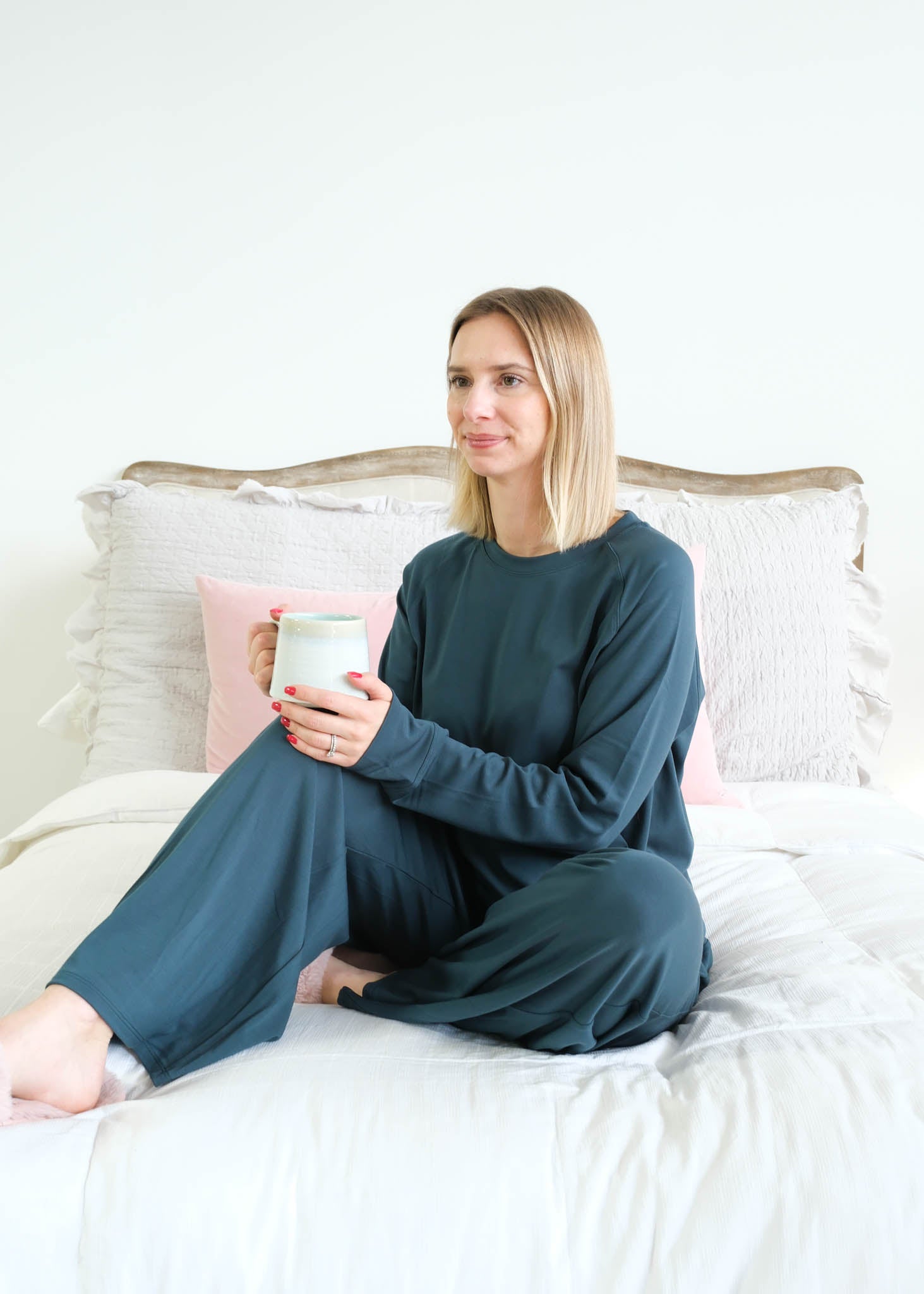 Miranda Nic Cloud Soft Teal Bamboo Lounge Set model seated lifestyle — Cloud Nine Pajamas Edmonton