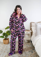 Full length view Georgia Rylan women's bamboo long sleeve button-up top and straight-leg pajama pants in Dreamy Blooms black floral print - Cloud Nine Pajamas on plus size model