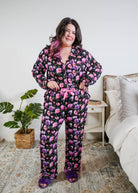 Georgia Rylan women's bamboo long sleeve button-up top and straight-leg pajama pants in Dreamy Blooms black floral print - Cloud Nine Pajamas shown tucked in to show the satin drawstring