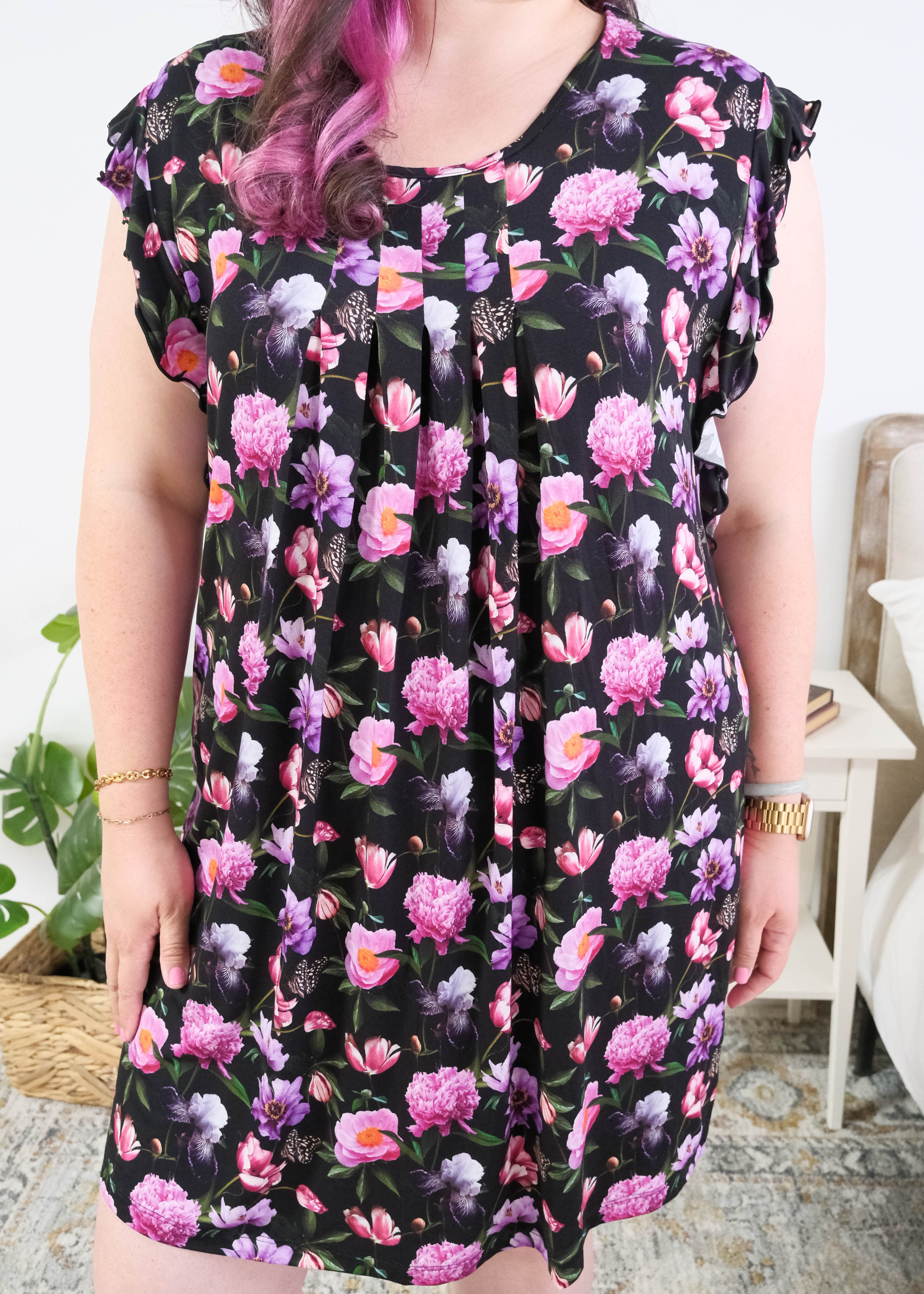 Georgia Rylan women's bamboo flutter sleeve nightgown dress in Dreamy Blooms black floral print - Cloud Nine Pajamas pleated front of the nightgown on plus size model