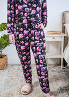 Georgia Rylan women's long sleeve crewneck top and jogger pajama pants set in Dreamy Blooms black floral bamboo Cloud Nine Pajamas showing hand in pocket and jogger print detail