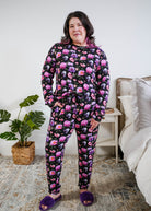 Tucked in view of the pyjama set on a plus size model full length Georgia Rylan women's long sleeve crewneck top and jogger pajama pants set in Dreamy Blooms black floral bamboo Cloud Nine Pajamas