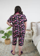 Georgia Rylan women's bamboo rolled-sleeve t-shirt and capri pajama pants in Dreamy Blooms black floral print - Cloud Nine Pajamas back view plus size model