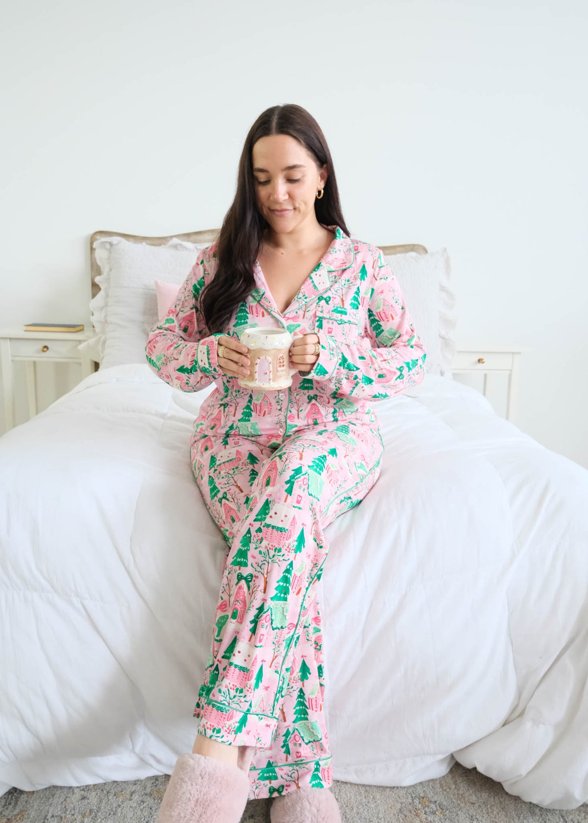 Georgia Rylan Sugar Plum Dreams Bamboo Button-Up PJ Set gingerbread print lifestyle model on bed — Cloud Nine Pajamas Edmonton