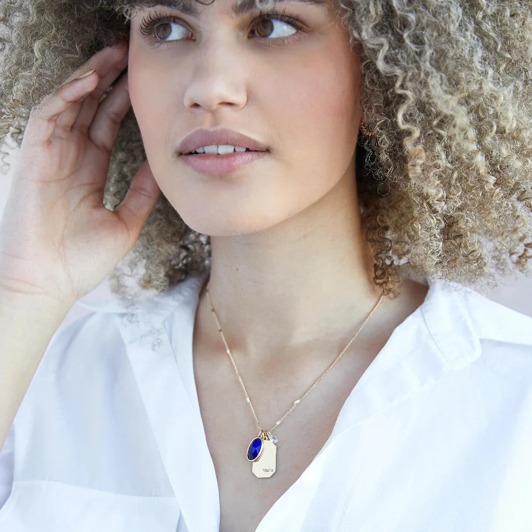 Birthstone Charm Necklace in 14k Plated Gold featuring September sapphire stone and 'TRUTH' charm by Foxy Originals.