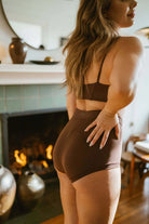 HUHA Mineral Brief Brown TENCEL Modal lifestyle on model back view — Cloud Nine Pajamas Edmonton