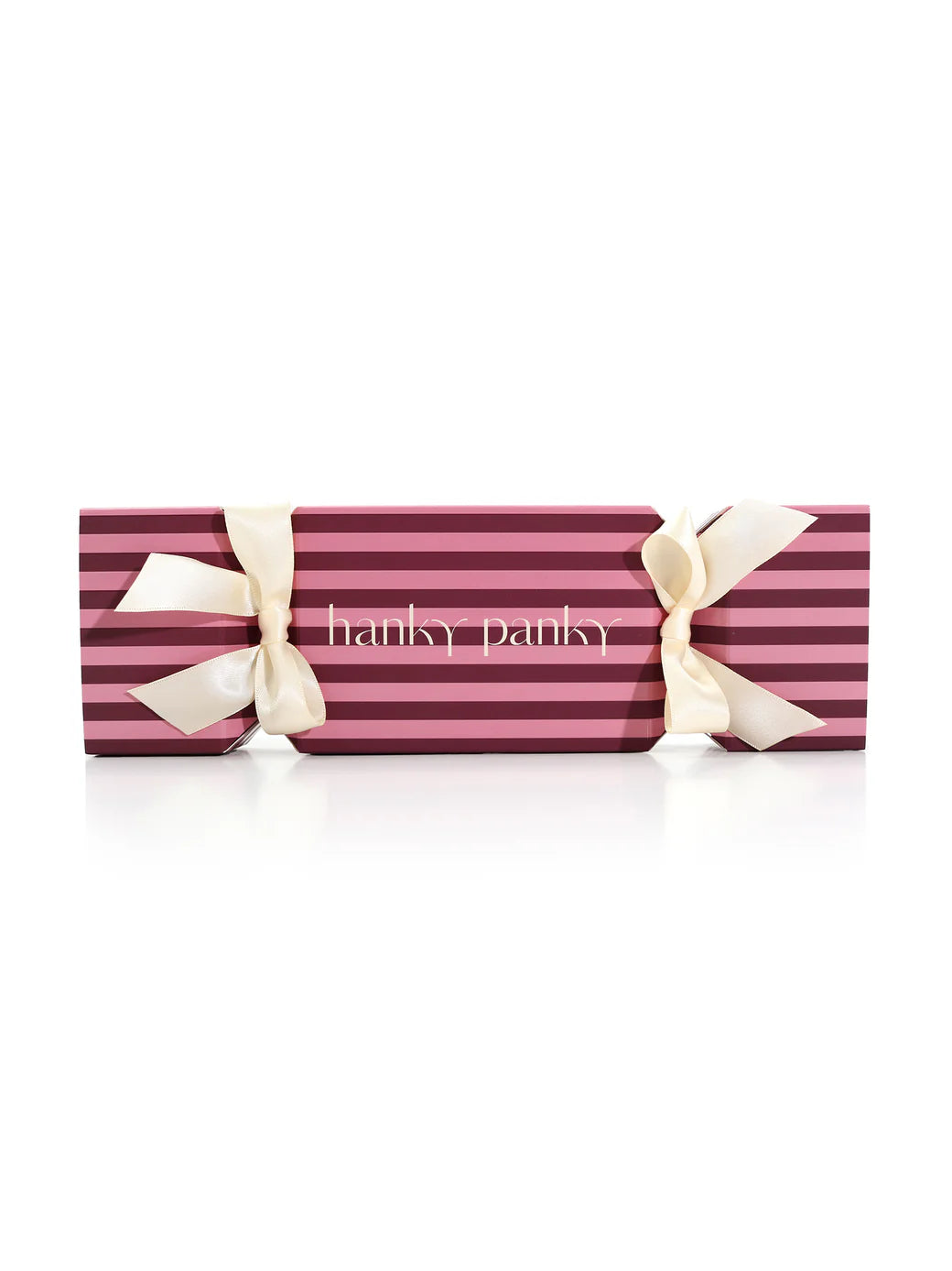 Retro Thong 3-Pack Gift Cracker packaging with pink and purple stripes and beige ribbons by Hanky Panky.