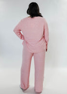 plus size woman standing wearing heather pink lounge set by miranda nic