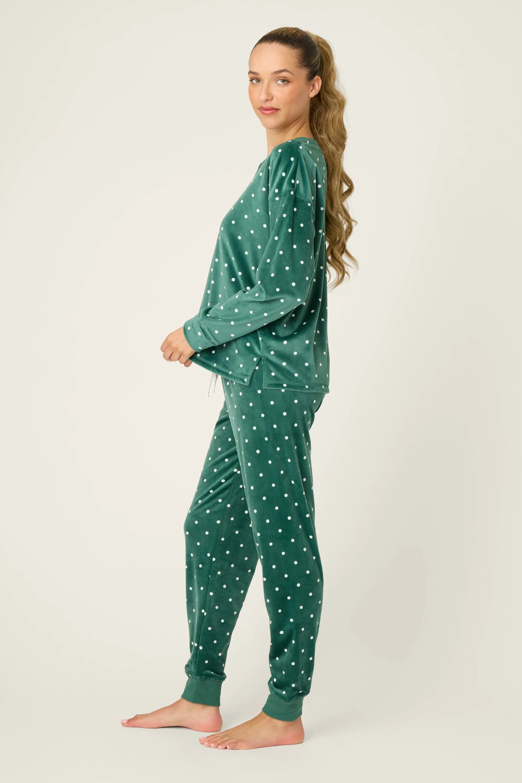 Let's Get Toasty Velour Dot Print PJ Set | Dark Forest Green PJ Salvage Women's white polka dot on a dark green background lightweight velour - Side view showing the side vents on top