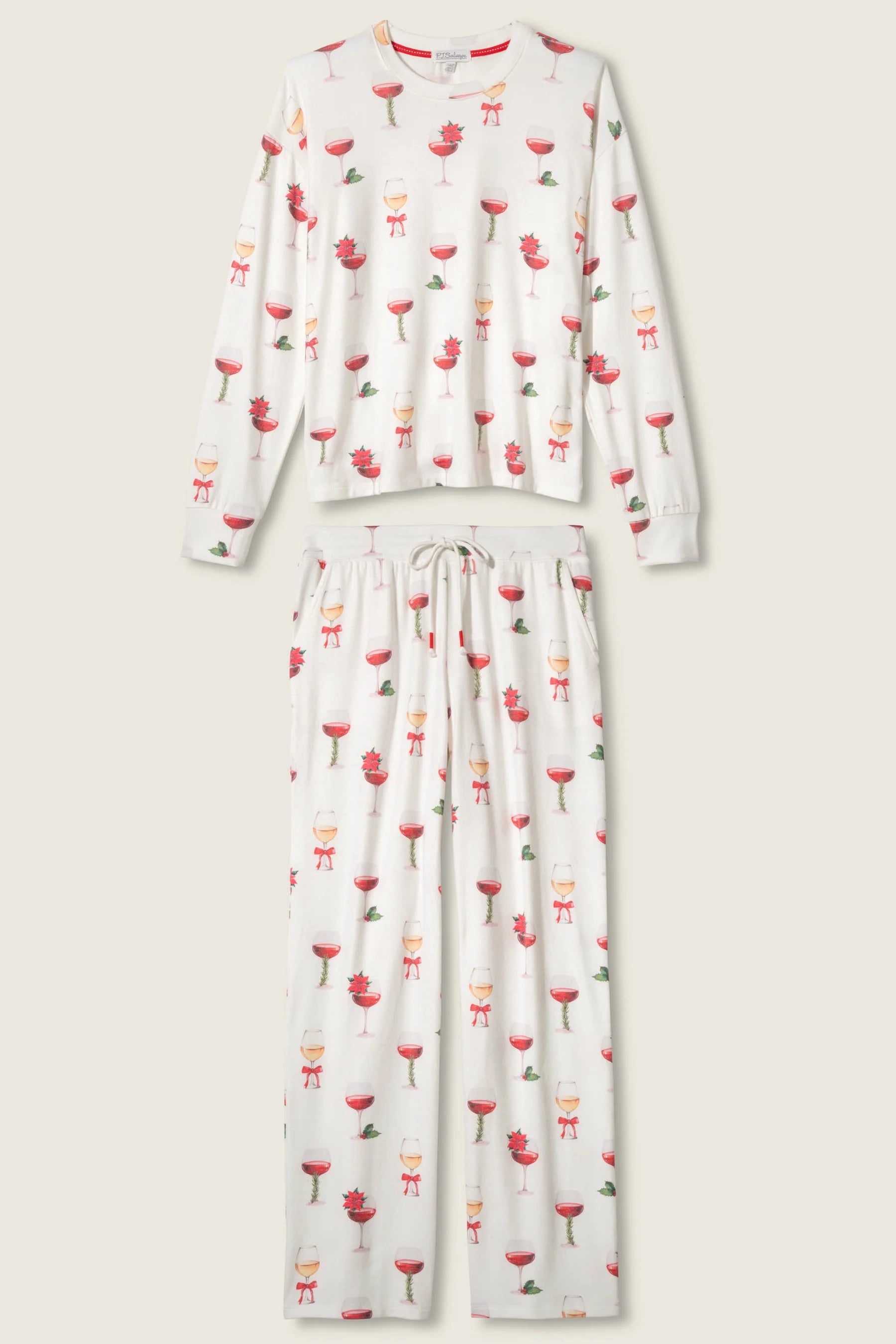 Let's Get Toasty Holiday Wine Print PJ Set | Champagne | PJ Salvage Women's set with champagne coupes with red liquid and holly, poinsettia and bows on an ivory background