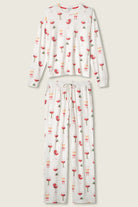 Let's Get Toasty Holiday Wine Print PJ Set | Champagne | PJ Salvage Women's set with champagne coupes with red liquid and holly, poinsettia and bows on an ivory background
