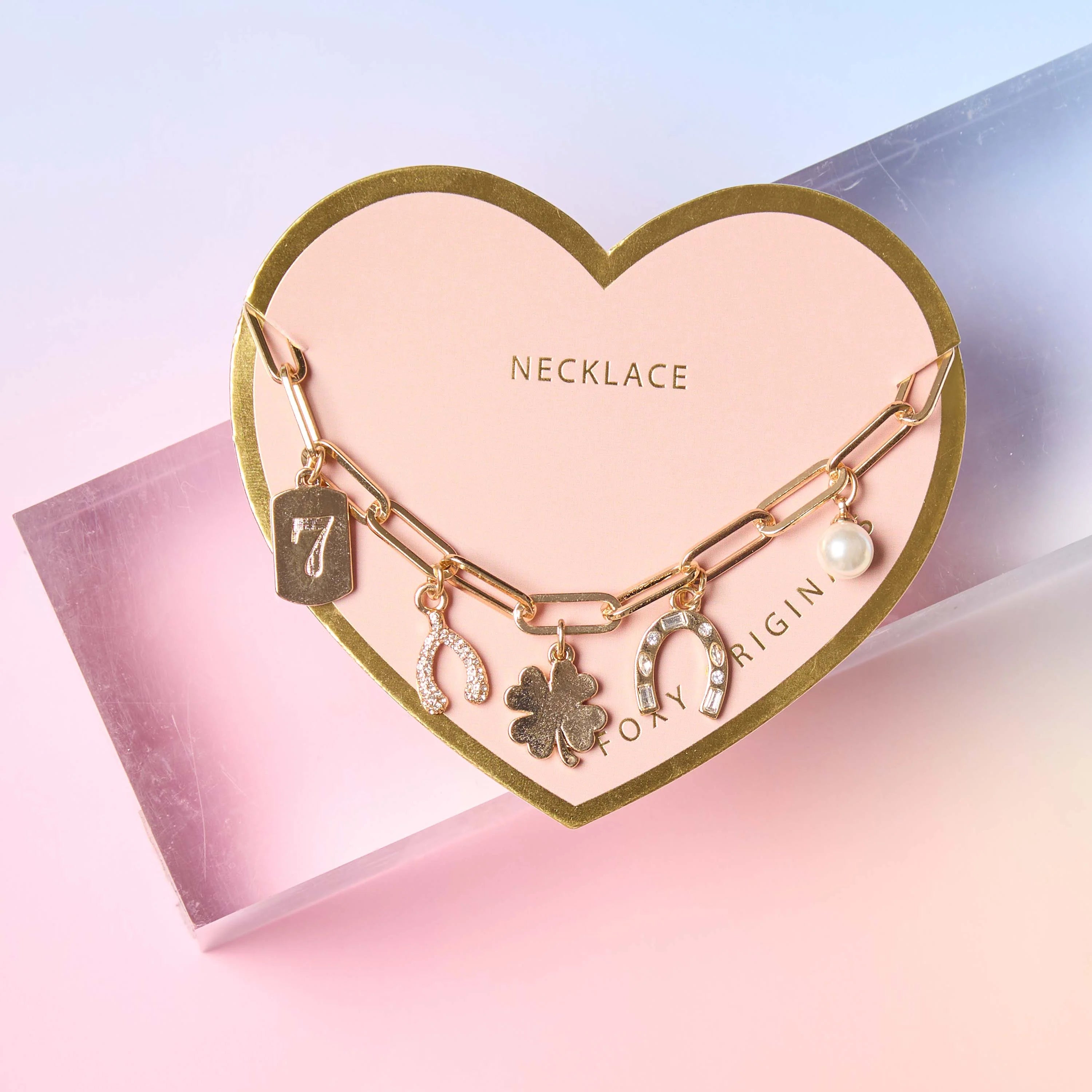 Lucky Charm Necklace in 14k Gold featuring charms including a shamrock, horseshoe, wishbone, and number 7.