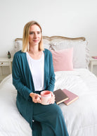 Georgia Rylan Midnight Teal Long Cardigan with Pockets lifestyle model — Cloud Nine Pajamas Edmonton