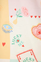 Lucky Me Tarot card print design featuring colorful patterns and symbols on fabric for PJ Salvage flannel PJ set.