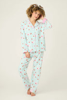 Model wearing Ma Cherie Cherry Print 3-Piece Flannel PJ Set from PJ Salvage in light blue with cherry pattern.
