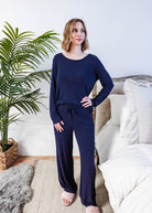 Miranda wearing the Navy Melange Top Straight Pant Knit Lounge Set, highlighting the boat-neck top and flowy trousers.
