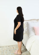 Miranda Nic Cloud Soft Rolled Sleeve Dress Black side view showing drape and knee length — Cloud Nine Pajamas Edmonton