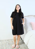 Miranda Nic Cloud Soft Rolled Sleeve Dress Black front view hand in pocket detail — Cloud Nine Pajamas Edmonton