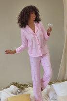 Happy Hour Wine Glass Print 3-Piece PJ Set | PJ Salvage women's wine glass print pj set in pink - button up long sleeve top, straight leg pants, and matching eye mask lifestyle shot of model