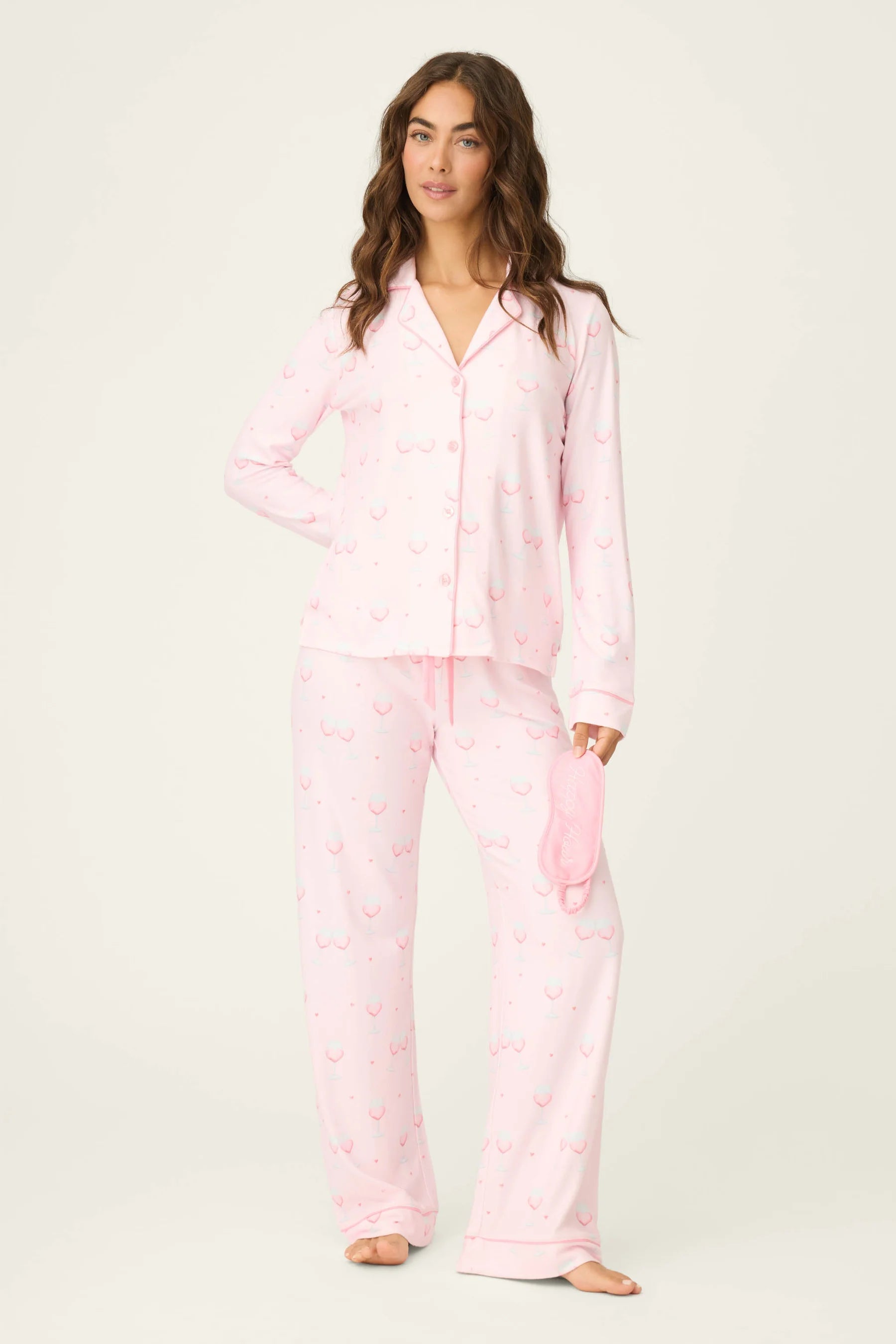 Happy Hour Wine Glass Print 3-Piece PJ Set | PJ Salvage women's wine glass print pj set in pink - button up long sleeve top, straight leg pants, and matching eye mask showing full length on model